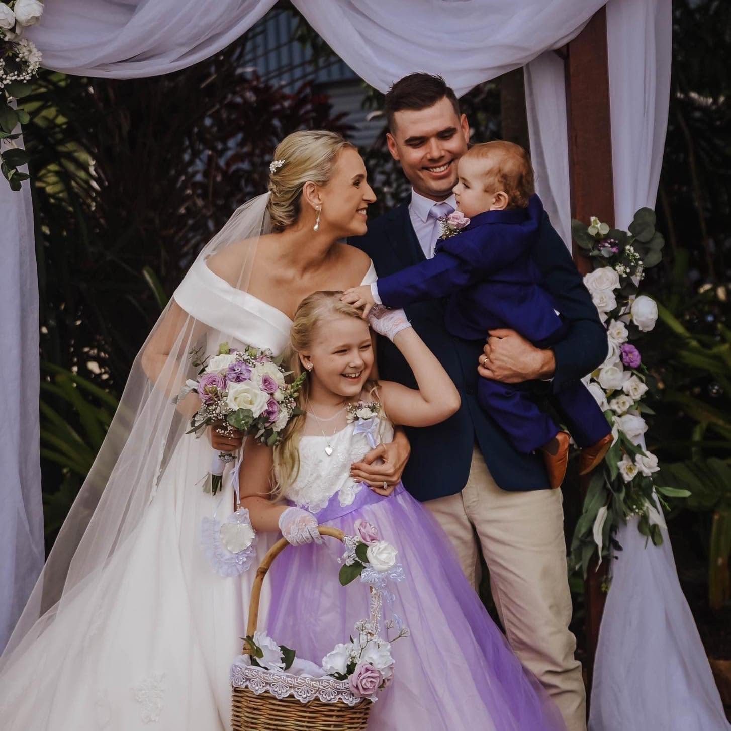 Bride, groom and children on their wedding day