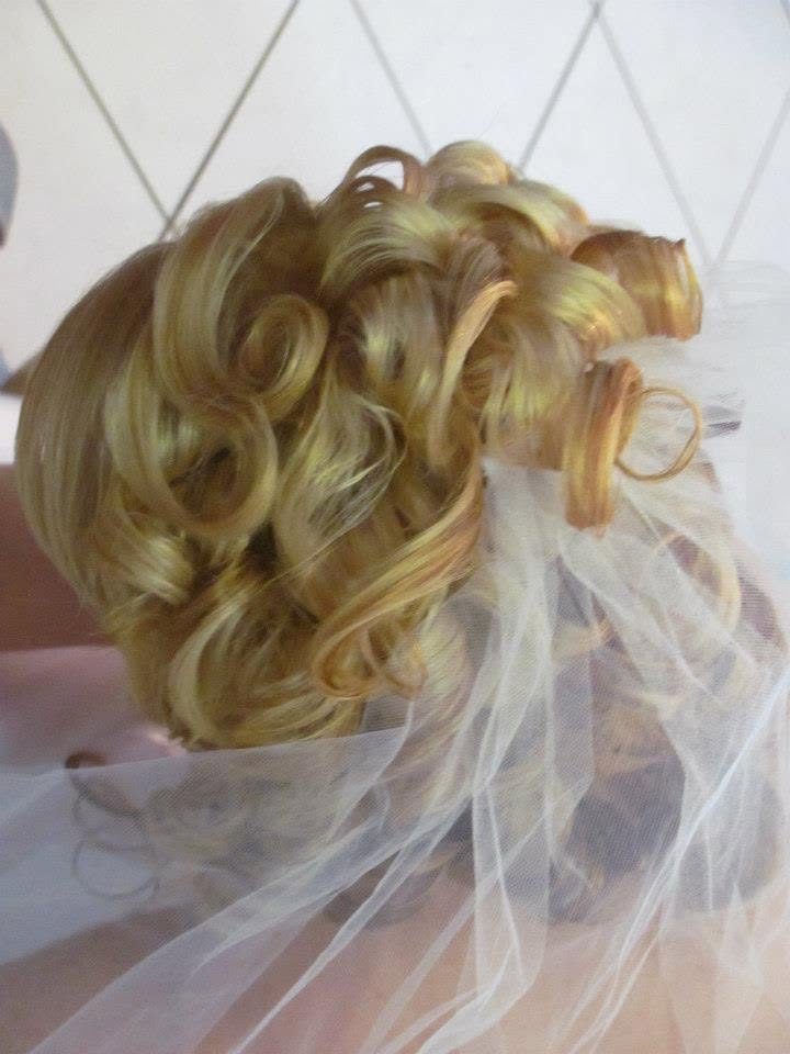 Bridal curled updo with veil